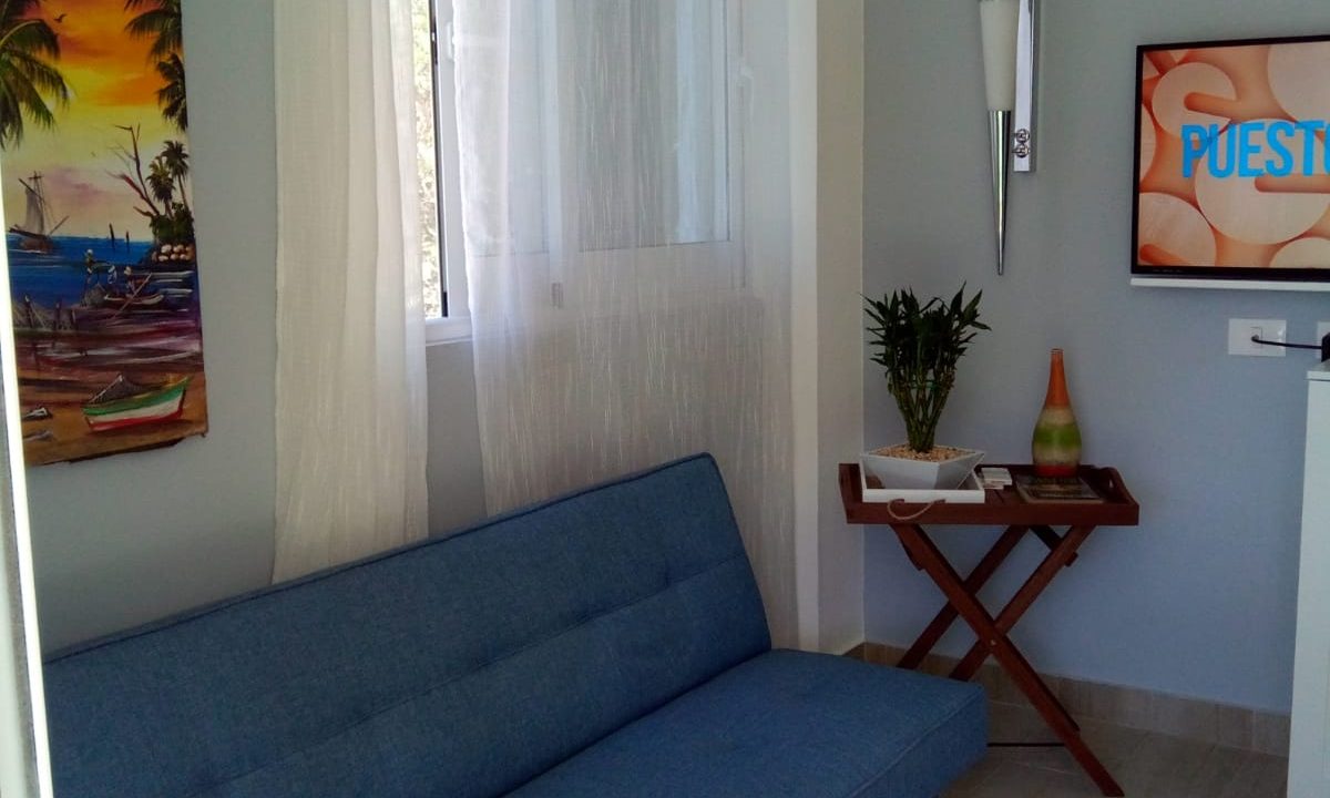 Tropical Comfort in Camino Llibre – Your Perfect 1-Bedroom Retreat (Living room)